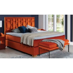 pomarańczowe łóżko tapicerowane